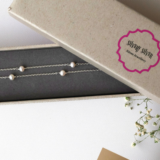 Long Silver & Pearl String